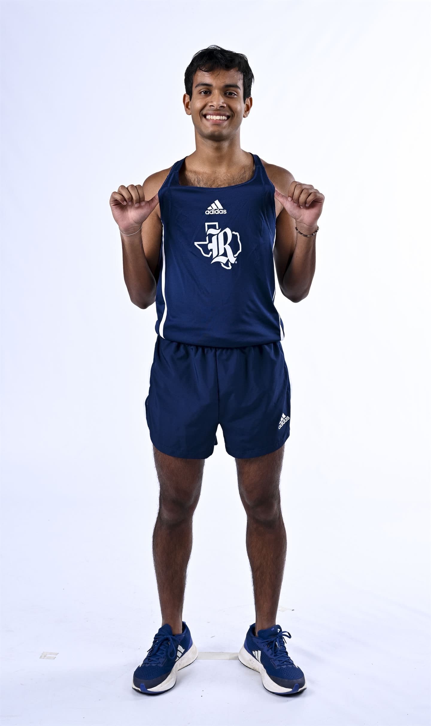 Vedant smiling in his running uniform
